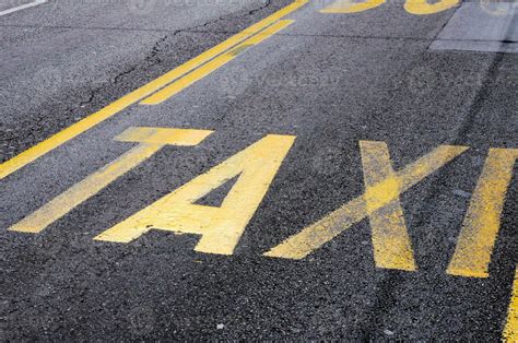 Taxi sign on the road 23302460 Stock Photo at Vecteezy