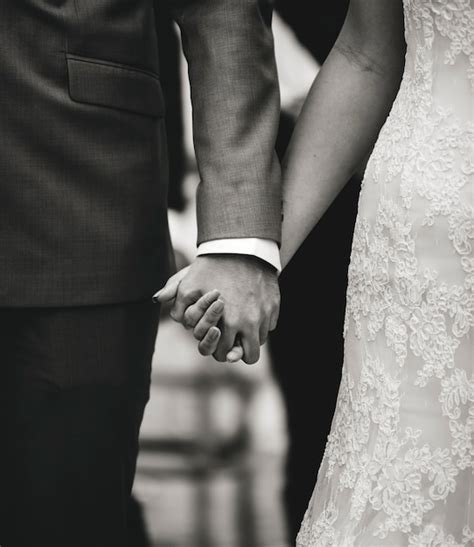 Free Photo Bride And Groom Holding Hands