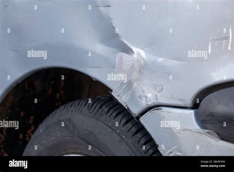 Damaged Bumper On A Grey Car Paint Scratched Botched Bad Repair Job