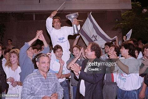 Supporters of right-wing Likud party jubilate in front of the Likud ...