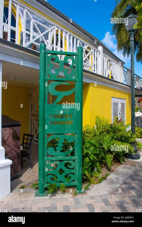 Sign of Pompey Square on Bay Street in historic downtown Nassau, New Providence Island, Bahamas ...