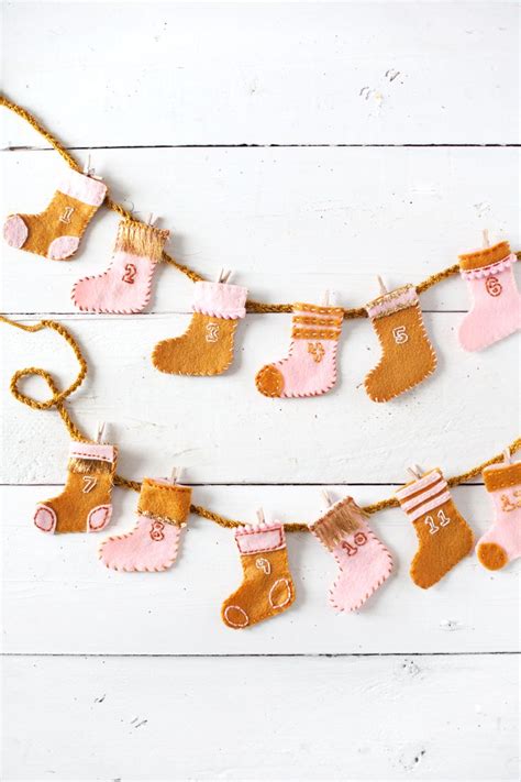 Diy Stocking Advent Calender Garland From A Beautiful Mess Christmas