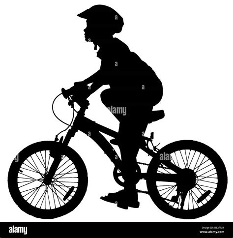 Silhouette Of Boy Riding A Push Bike Stock Photo Alamy