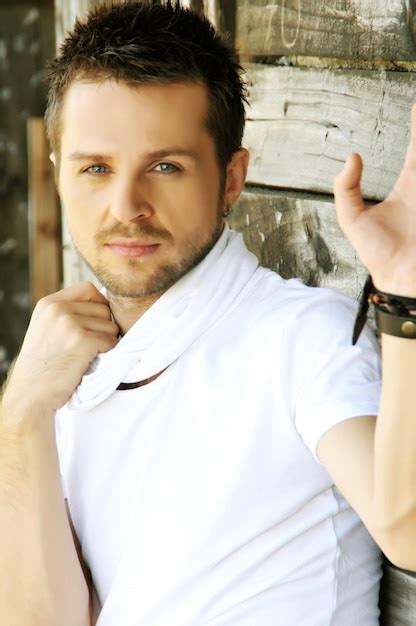 Premium Photo Portrait Of Man Standing Outdoors