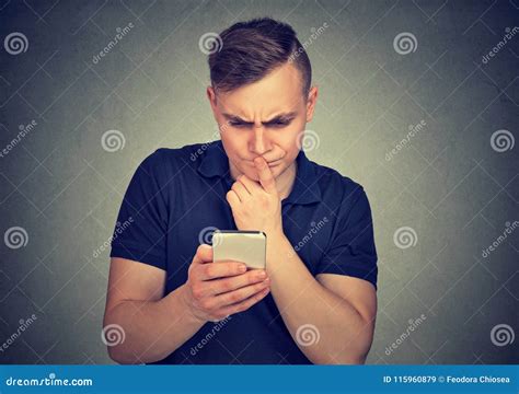 Clueless Dumb Guy Having Troubles With His Smartphone Stock Image