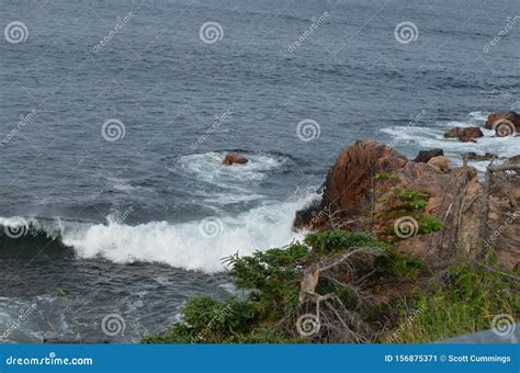 Summer in Nova Scotia: Wave Breaks on Rocky Shore Near Ingonish on Cape ...