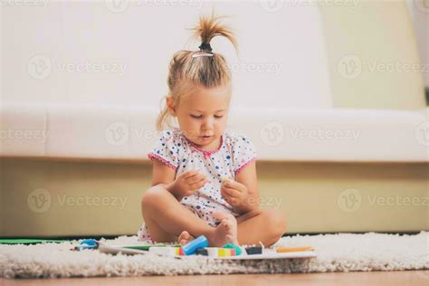 A child playing with toys 23910266 Stock Photo at Vecteezy