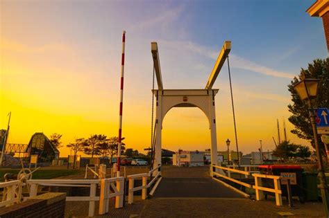 Premium Photo | View of bridge at sunset