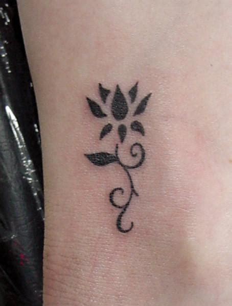 11 Beautiful Tribal Lotus Flower Tattoos