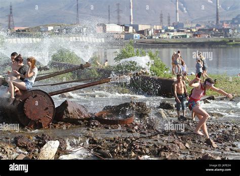 Norilsk, Russia. 23rd July, 2017. City residents seen by a lake at ...