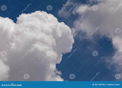 High Altitude Cumulonimbus Clouds With Clear Blue Sky Background Stock