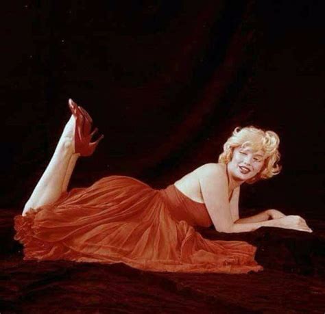 Behind The Scenes Photos Of Marilyn Monroe Playfully Poses During The The Red Dress Sitting