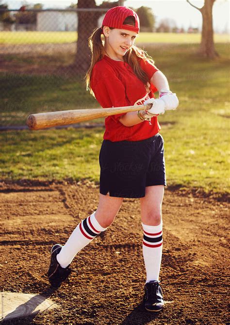 A Young Girl In Retro Baseball Jersey Swinging Baseball Bat By Stocksy Contributor Tana Teel