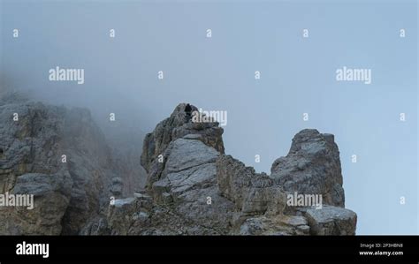 Tourist With Equipment On The Via Ferrata Trail In The Alps Dolomites