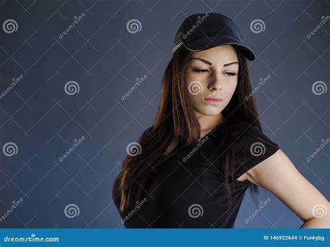 Brunette Girl Holding Her Cap While Posing Studio Stock Photo Image