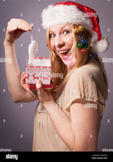 Blonde Adult Woman Is Very Happy About Her Christmas Gift Stock Photo Alamy