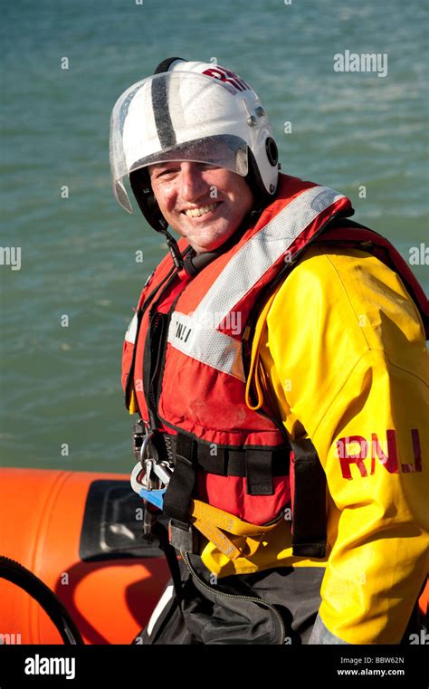 Male Rnli Inshore Rescue Lifeboat Crew Member Wearing Full Safety