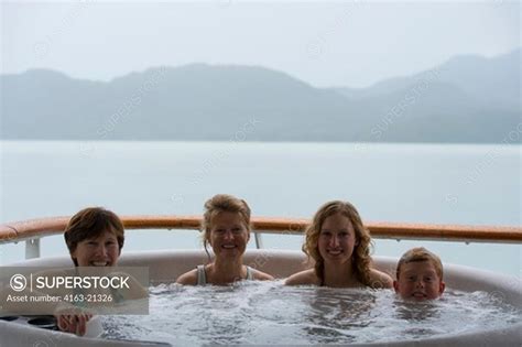 Passengers Enjoying The Hot Tub On The Cruise Ship Safari Endeavour Anchgored At Scenery Cove