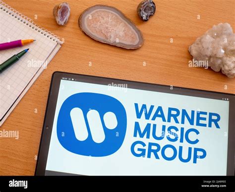 In This Photo Illustration Warner Music Group Logo Seen Displayed On A