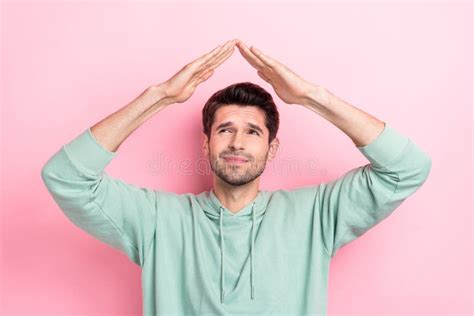 Portrait Of Minded Person Look Interested Arms Make Roof Gesture Above Head Isolated On Pink