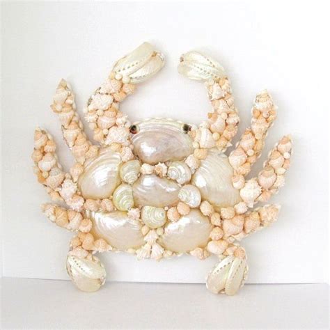 a crab made out of seashells and shells