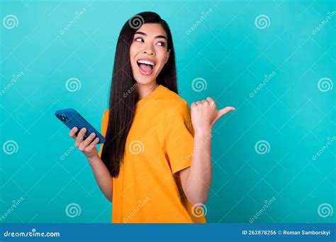 Photo Of Impressed Millennial Lady Index Empty Space Hold Telephone