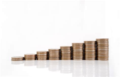 Premium Photo Close Up Of Stack Coins Against White Background