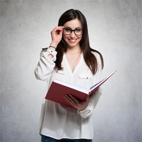 Premium Photo Portrait Of A Young Woman Holding A Book