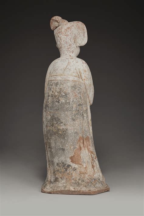 A LARGE PAINTED POTTERY FIGURE OF A COURT LADY TANG DYNASTY AD 618