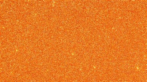 Premium Photo | Orange glitter texture for background.