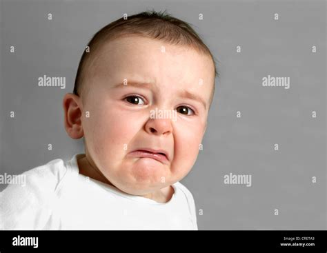 Distressed 11 month old baby boy crying Stock Photo - Alamy