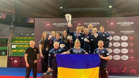 A Group Of Women Standing On Top Of A Blue And Yellow Floor Next To