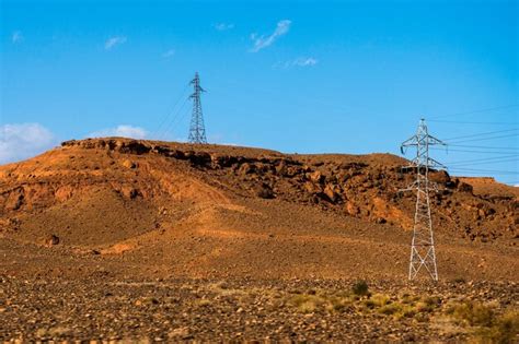 Premium Photo High Voltage Transmission Towers For Electricity In Sahara