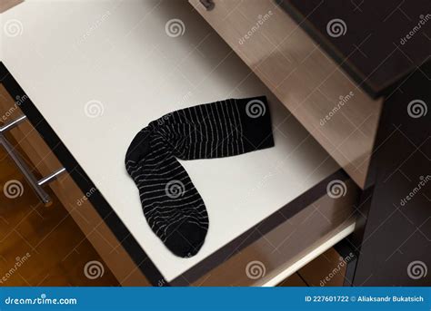 Black Lost Sock In An Open Dresser Shelf Stock Photo Image Of Case