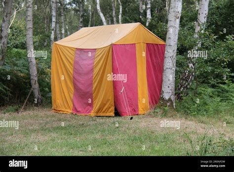 A Colourful Red And Yellow Tent In A Woodland Setting Stock Photo Alamy