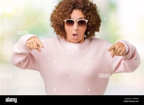 Beautiful Middle Ager Senior Woman Wearing Pink Sweater And Sunglasses
