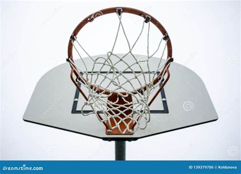 Basketball Hoop On A School Playground Against A Cloudy Sky Stock Photo ...