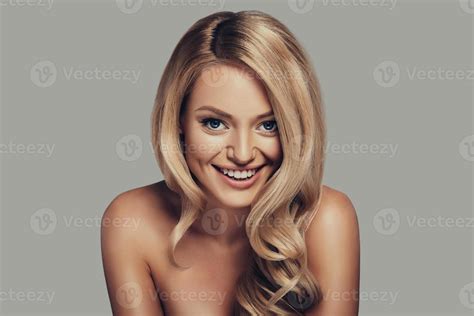 Full Of Life Energy Attractive Young Woman With Long Curly Blond Hair