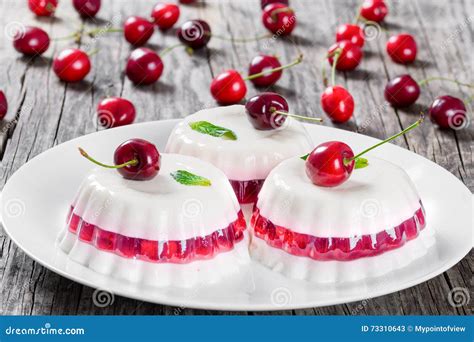 Cherry Panna Cotta Of Sweetened Cream Thickened With Gelatin Stock