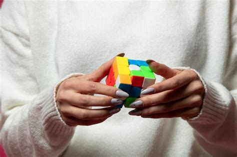 Free Photo Woman Holding Rubik S Cube In Hands