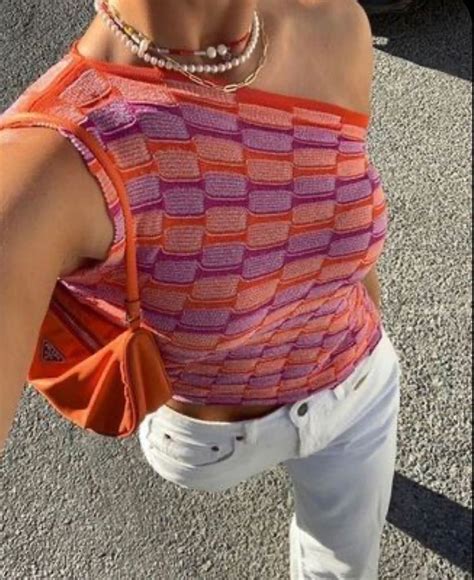 Outfit Photo Of A Woman Wearing A Pink Purple And Orange Knit One