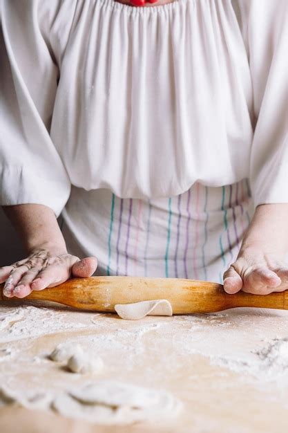 Premium Photo Front Mid View Of Womans Hands Making Meat Dumpling With Wooden Rolling Pin