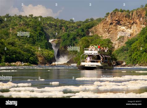 A Tourist Boat At Murchison Falls Waterfall On The Victoria Nile River