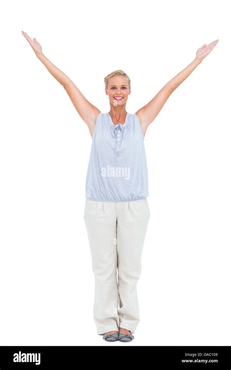 Blonde Woman Standing With Hands Up Looking At Camera Stock Photo Alamy