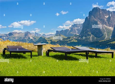 Lounge Chairs Overlooking In Dolomites Mountains Stock Photo Alamy