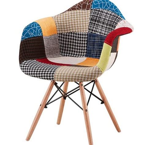 A Multicolored Chair With Wooden Legs And A Patchwork Upholstered Seat