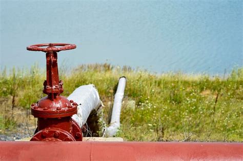 Premium Photo Close Up Of Fire Hydrant On Field Against Wall