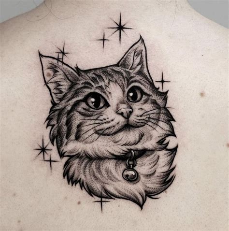 A Cat Tattoo On The Back Of A Woman S Upper Arm And Chest With Stars