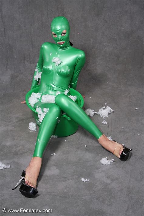 Busty Babe In Green Latex Jumpsuit Posing W XXX Dessert Picture