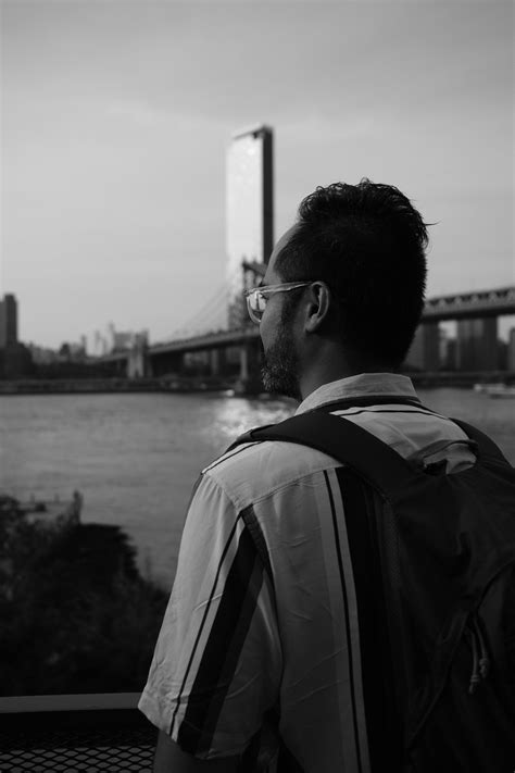 Black And White Silhouette Of Man Standing In Building Gate · Free